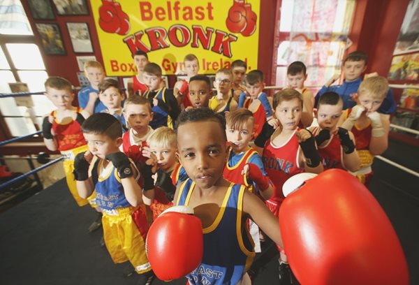 A group of children taking part in boxing training.
