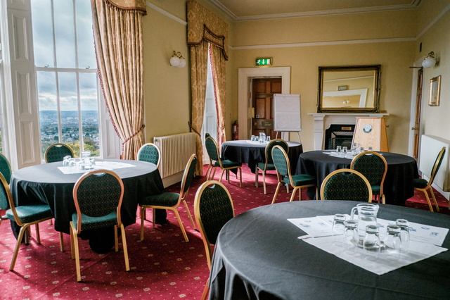 Ben Madigan Room with tables and chairs in a cabaret style setup.