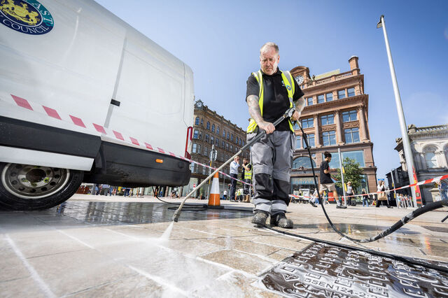Belfast city centre street being pressure washed