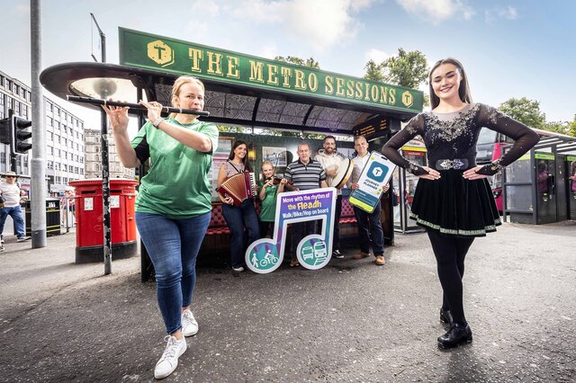 'Metro Sessions' bus stop in Belfast city centre, Cllr Arder Carson, Translink's Sean McGreevy and Traditional Irish musicians and dancer