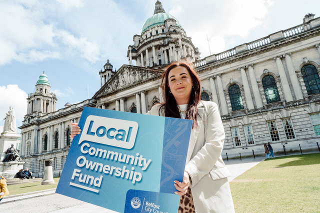Councillor Natasha Brennan pictured promoting the Local Community Ownership Fund outside Belfast City Hall