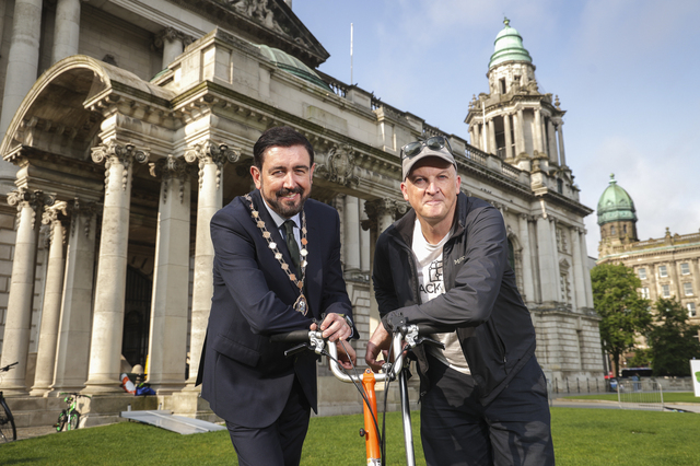 Deputy Lord Mayor of Belfast, Councillor Paul Doherty and Stephen McNally from Cycul on lawns of City Hall with a brompton bike
