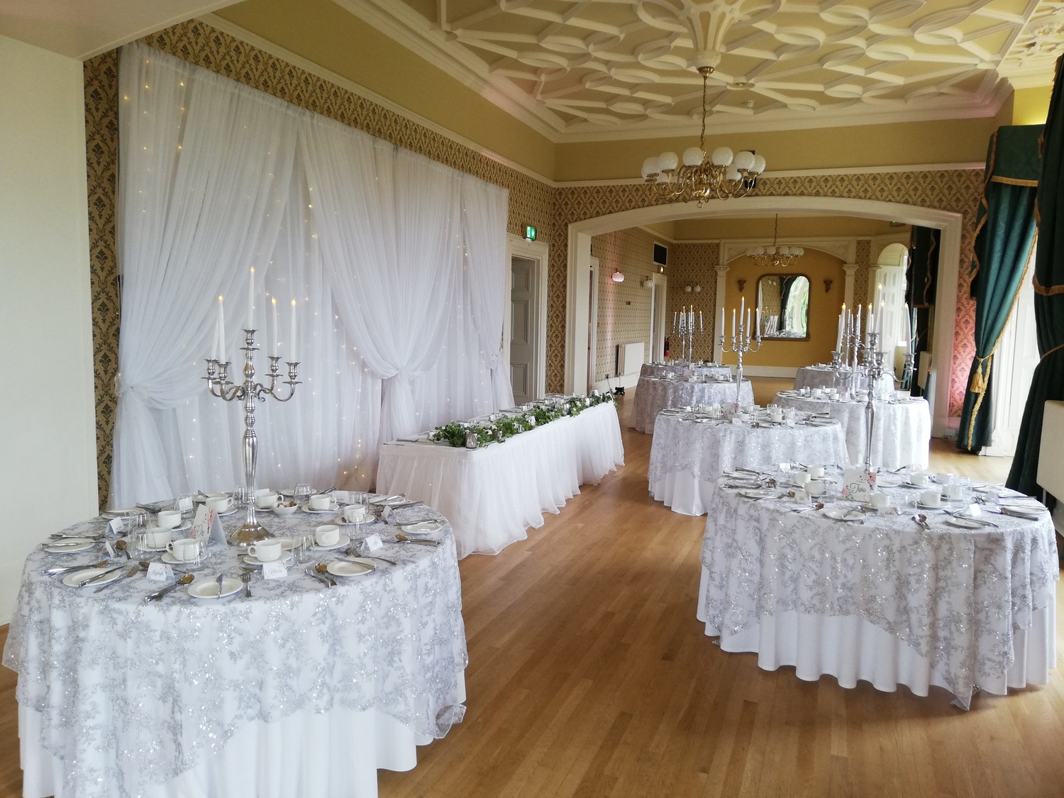 Chichester Room set up for a wedding banquet, showing three circular tables and the top rectangular table.