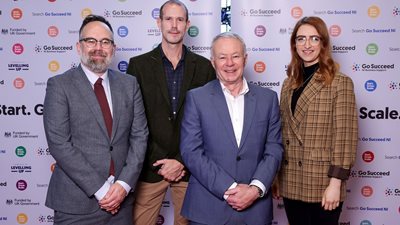 Philip Lloyd and Chris Moore from Department of Levelling Up, Housing & Communities with John Walsh, Chief Executive, Belfast City Council and Cllr Cliodhna Nic Bhranair at Go Succeed launch.