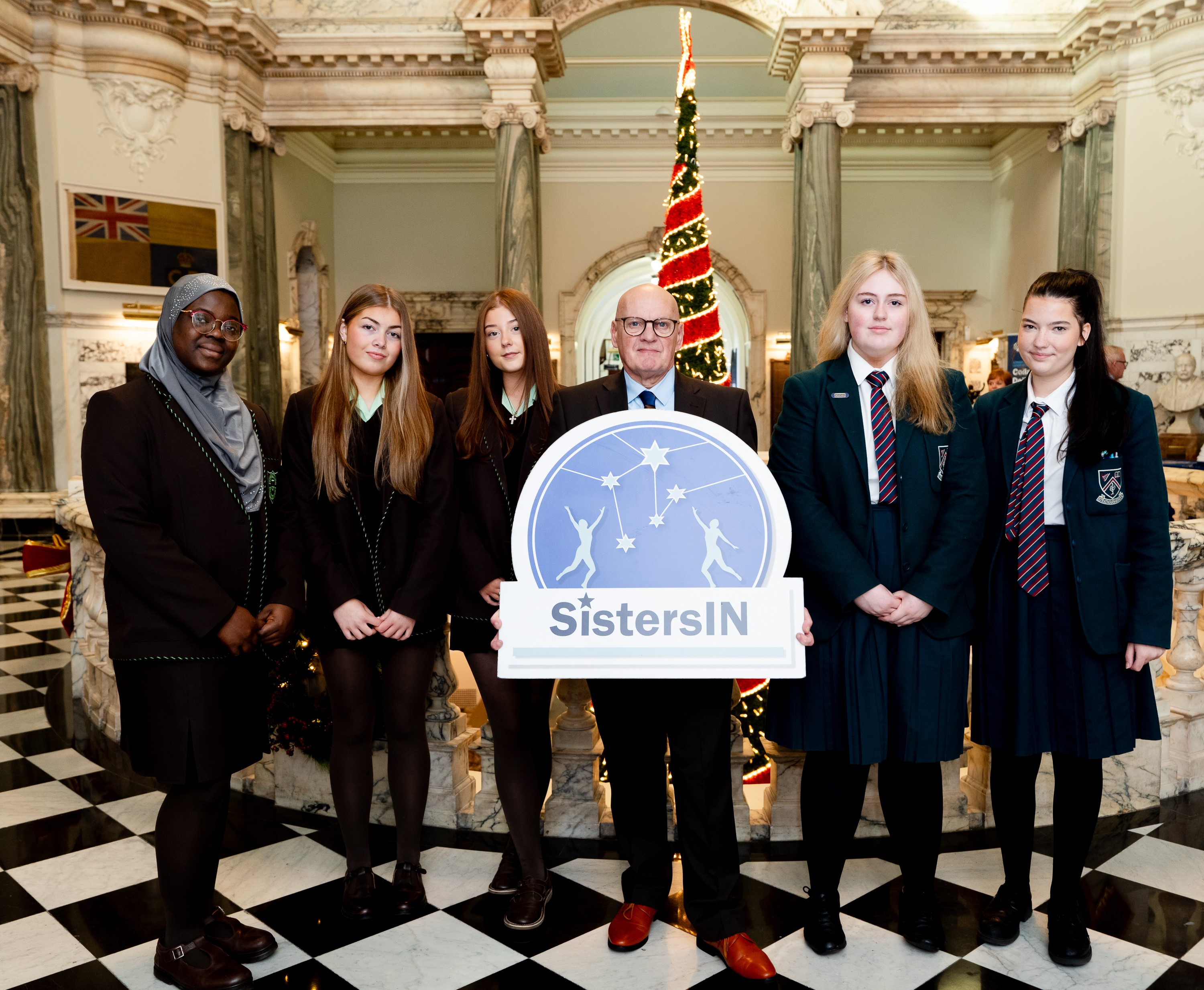 Councillor Ian McLaughlin with pupils from St Louise's and Strathearn grammar schools