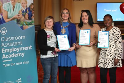 Participants in Belfast City Council's first Classroom Assistant Employment Academy receive certificates from Lord Mayor Cllr Tina Black