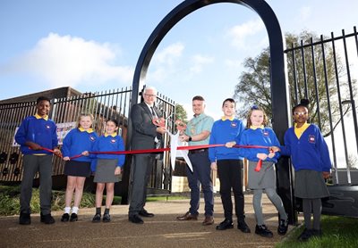 Children from Malvern Street Primary school help open a new play park on the Lower Shankill