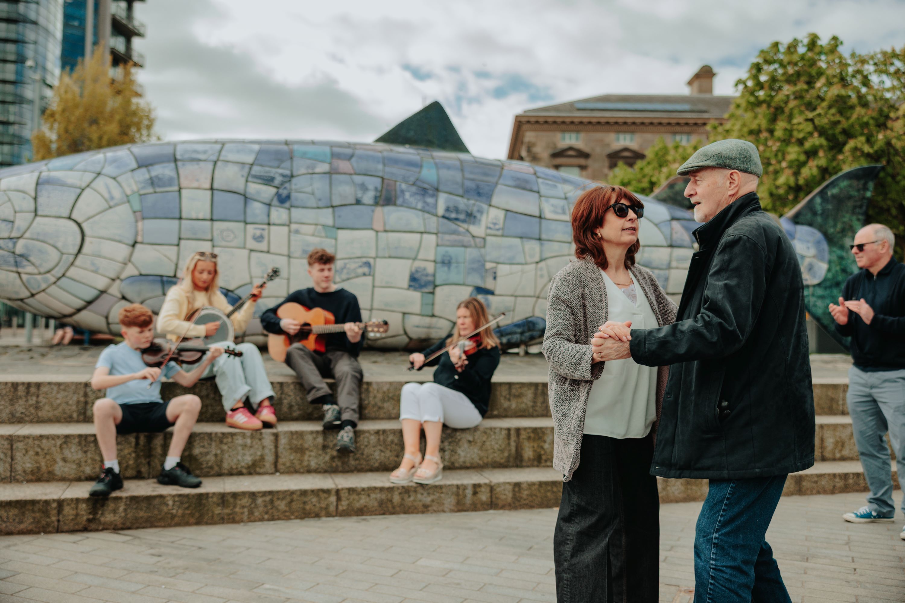 Musicians and people dancing at the Big Fish