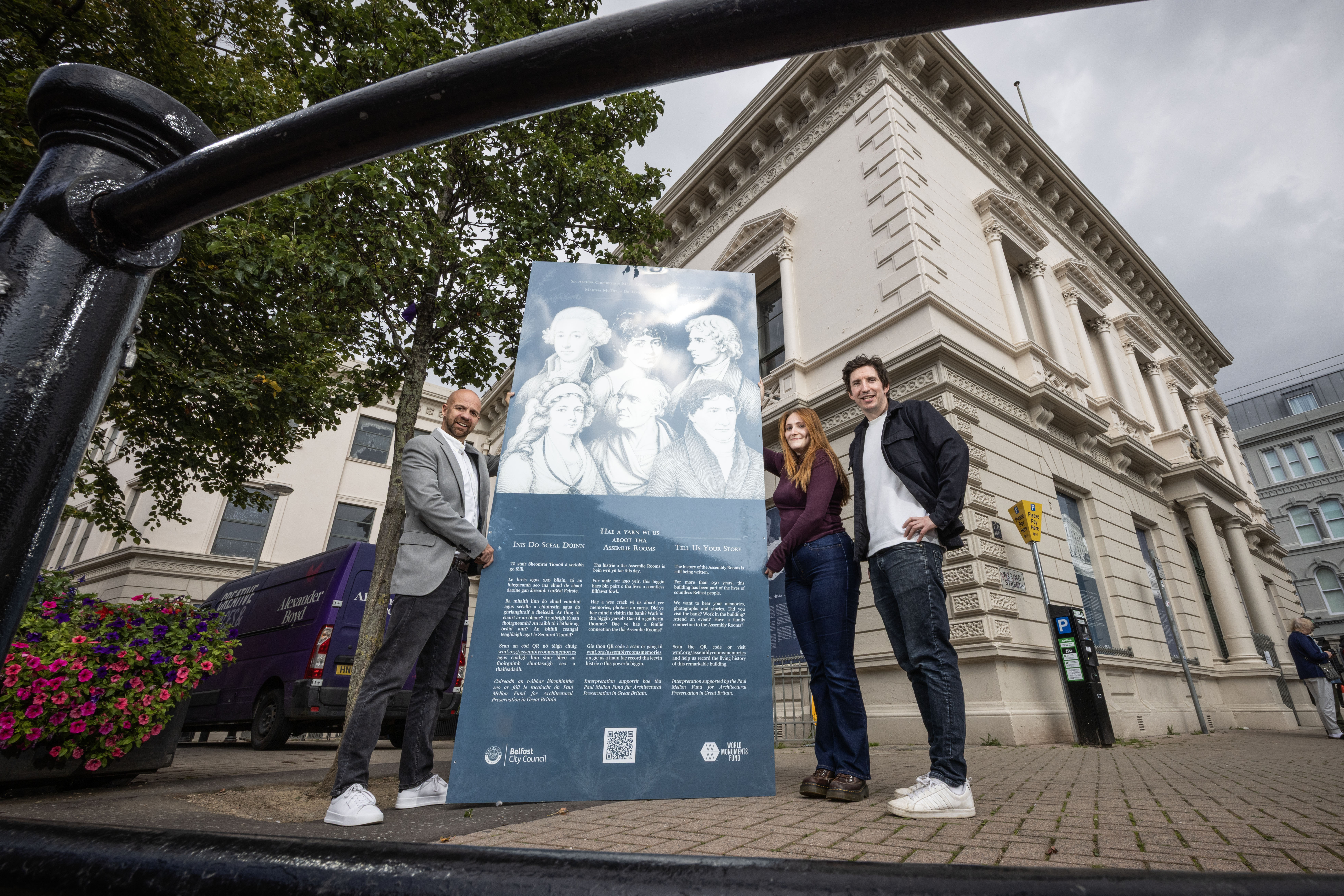 Councillor Joe Duffy, Chloe Glass and James Grieve pictured with one of 29 interpretative panels at Assembly Rooms