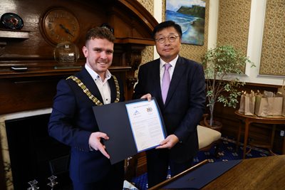 Lord Mayor Ryan Murphy and Vice Mayor for Economic Affairs in Sejong Seung Won Lee with Memorandum of Understanding document