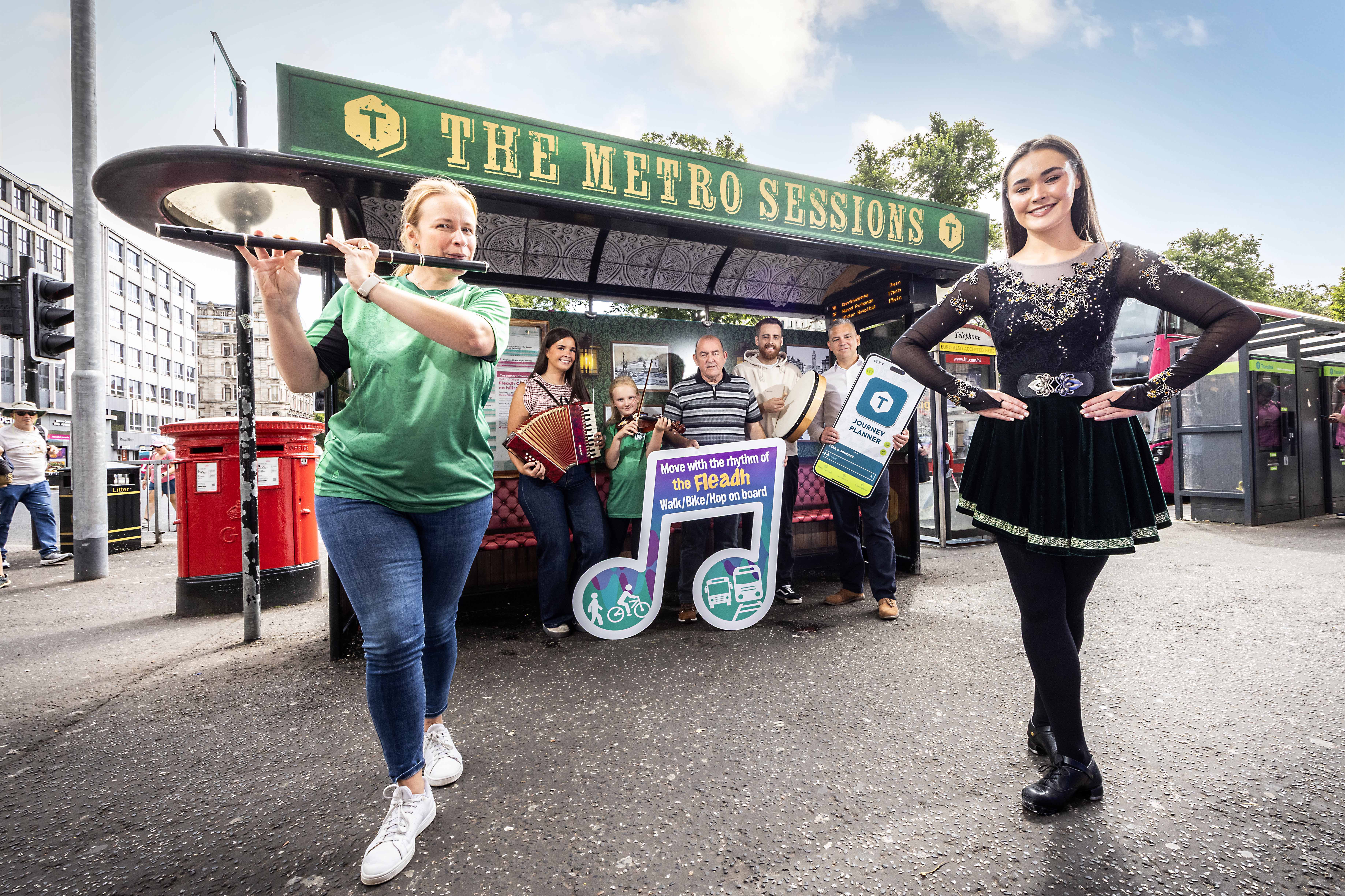 'Metro Sessions' bus stop in Belfast city centre, Cllr Arder Carson, Translink's Sean McGreevy and Traditional Irish musicians and dancer