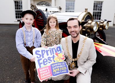 Two young children with Chitty Chitty Bang Bang replica car and Lord Mayor