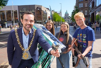 Lord Mayor Councillor Micky Murray with young musicians in Belfast city centre