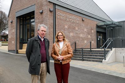 Dr Paul Mullan from The National Lottery Heritage Fund and Belfast Lord Mayor Councillor Christina Black outside the newly opened visitor centre - a red brick building with pitched roof