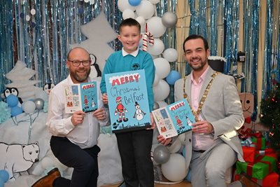 Lord Mayor Councillor Micky Murray with Cranmore IPS Principal and school pupil who helped design the Lord Mayor's Christmas card this year holding the cards.