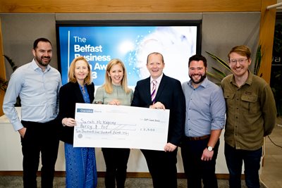 Belfast Business Idea winner Sarah McKegney receives a cheque for her prize from representatives of the competition sponsors.