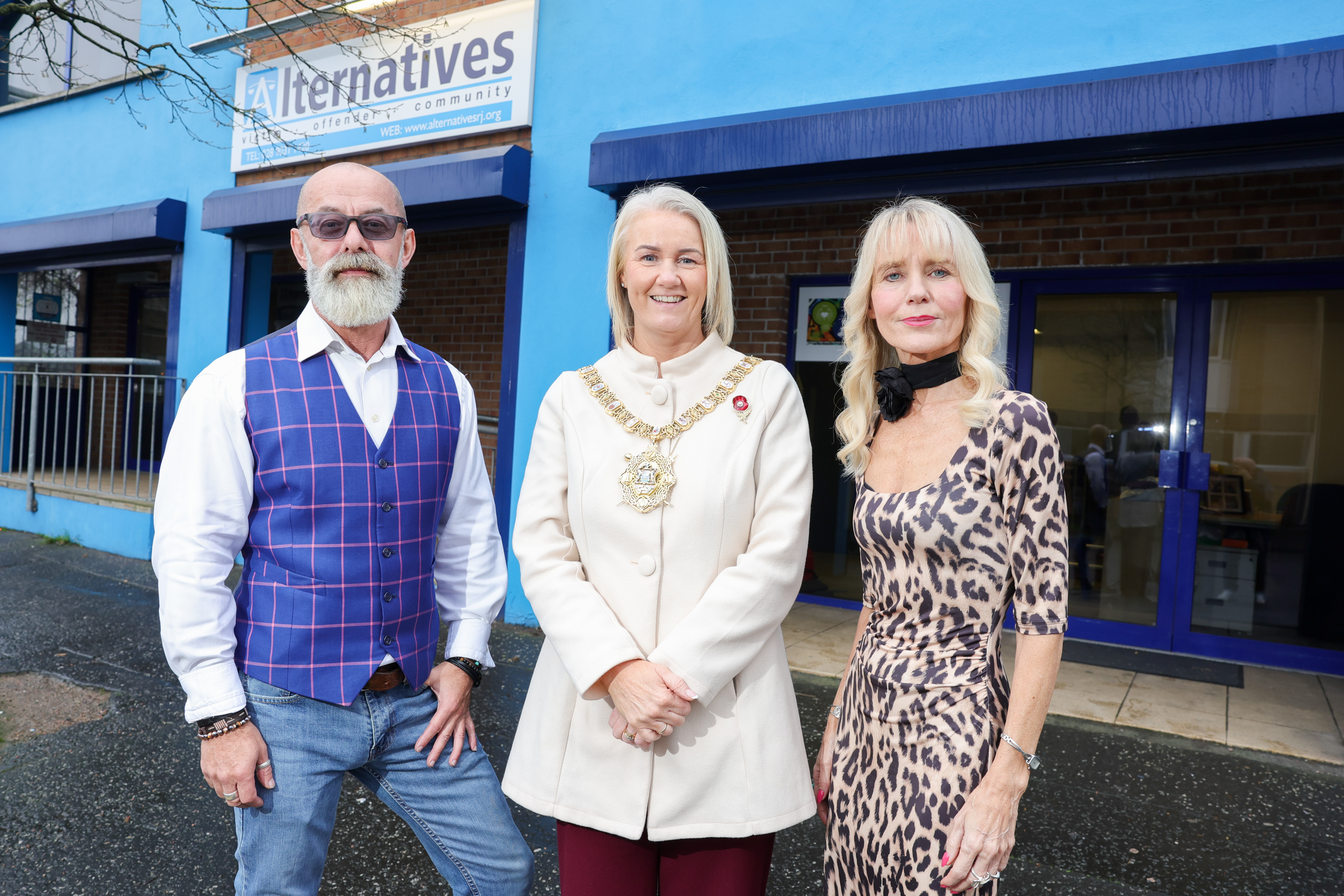 Lord Mayor of Belfast, Councillor Tracy Kelly, is joined by Emmett Watters, therapist with NI Alternatives’ MIND project, and Co-Director Debbie Watters OBE outside NI Alternatives' offices.