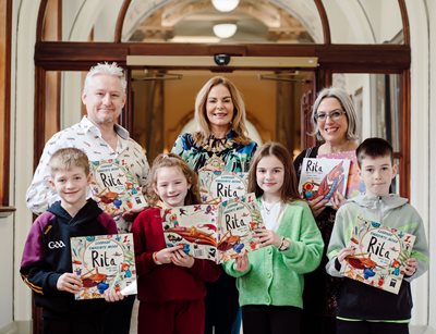 Lord Mayor Tina Black with Máire Zepf, Andrew Whitson and four primary schoolchildren in City Hall for event to mark Seachtain na Gaeilge/Irish Language Week. 