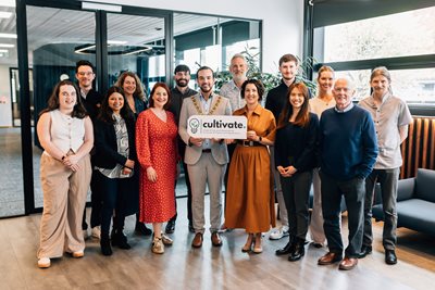 Lord Mayor of Belfast, Councillor Micky Murray, and Lisa McLaughlin, Managing Partner with Herbert Smith Freehills, join participants from the Cultivate programme.