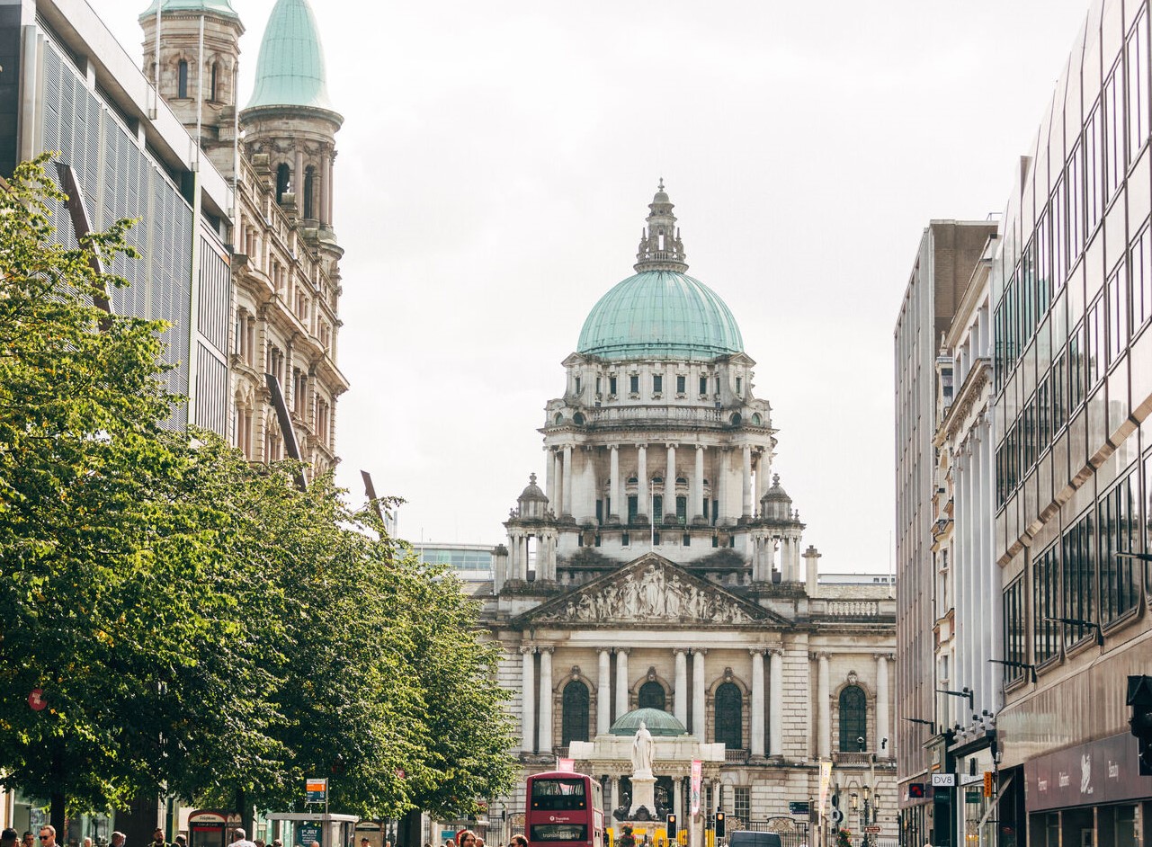 A view of Belfast City Hall from the end of a shopping street in Belfast City Centre.