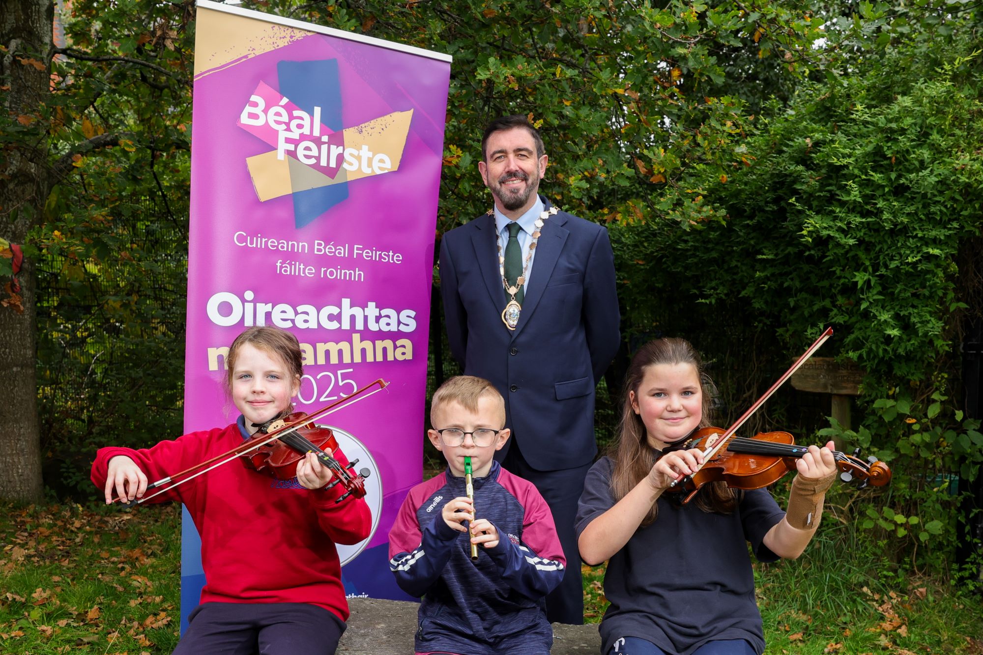 Deputy Lord Mayor of Belfast, Councillor Paul Doherty, with pupils from Scoil an Droichead.