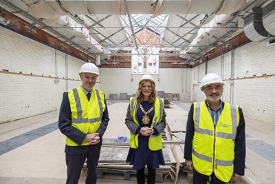Adrian Walker from GLL, Belfast Lord Mayor Councillor Christina Black and Mukesh Sharma from The National Lottery Heritage Fund at Templemore Baths 