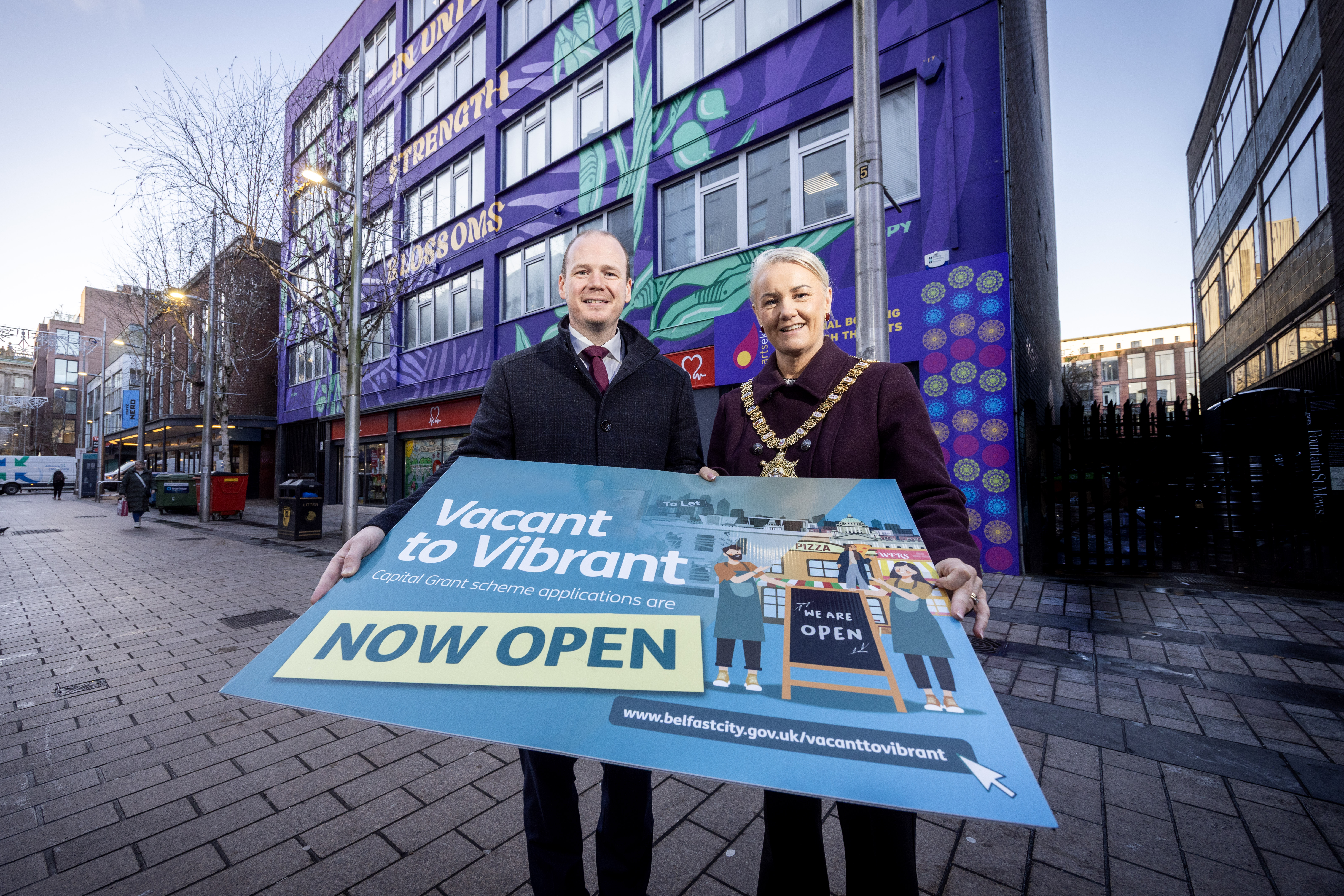 Minister Gordon Lyons and Belfast Lord Mayor Councillor Tracy Kelly outside Olive Tree House in Belfast city centre
