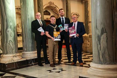 Four people including the Lord Mayor inside City Hall