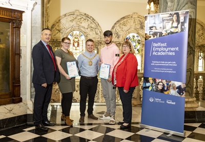 Lord Mayor Councillor Ryan Murphy with graduates from the Belfast Employment Academies and representatives from the Department for Communities at a celebration event at City Hall