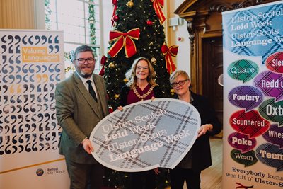 Image shows Ian Crozier, Lord Mayor Tina Black and Jennifer Crockard at Ulster-Scots Language Week event in City Hall