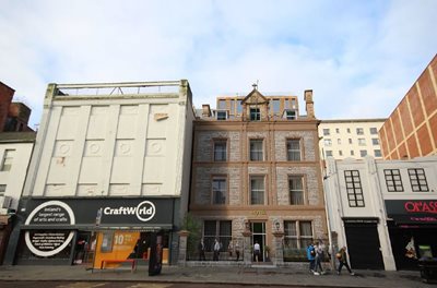 Buildings on Queen Street in the city centre with the middle building to be converted into a new hotel