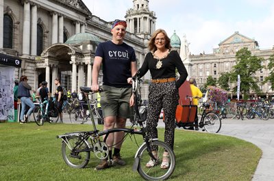 Lord Mayor Councillor Tina Black and Stephen McNally from Cycul in the grounds of City Hall, standing with bikes at the Ride on Belfast event.