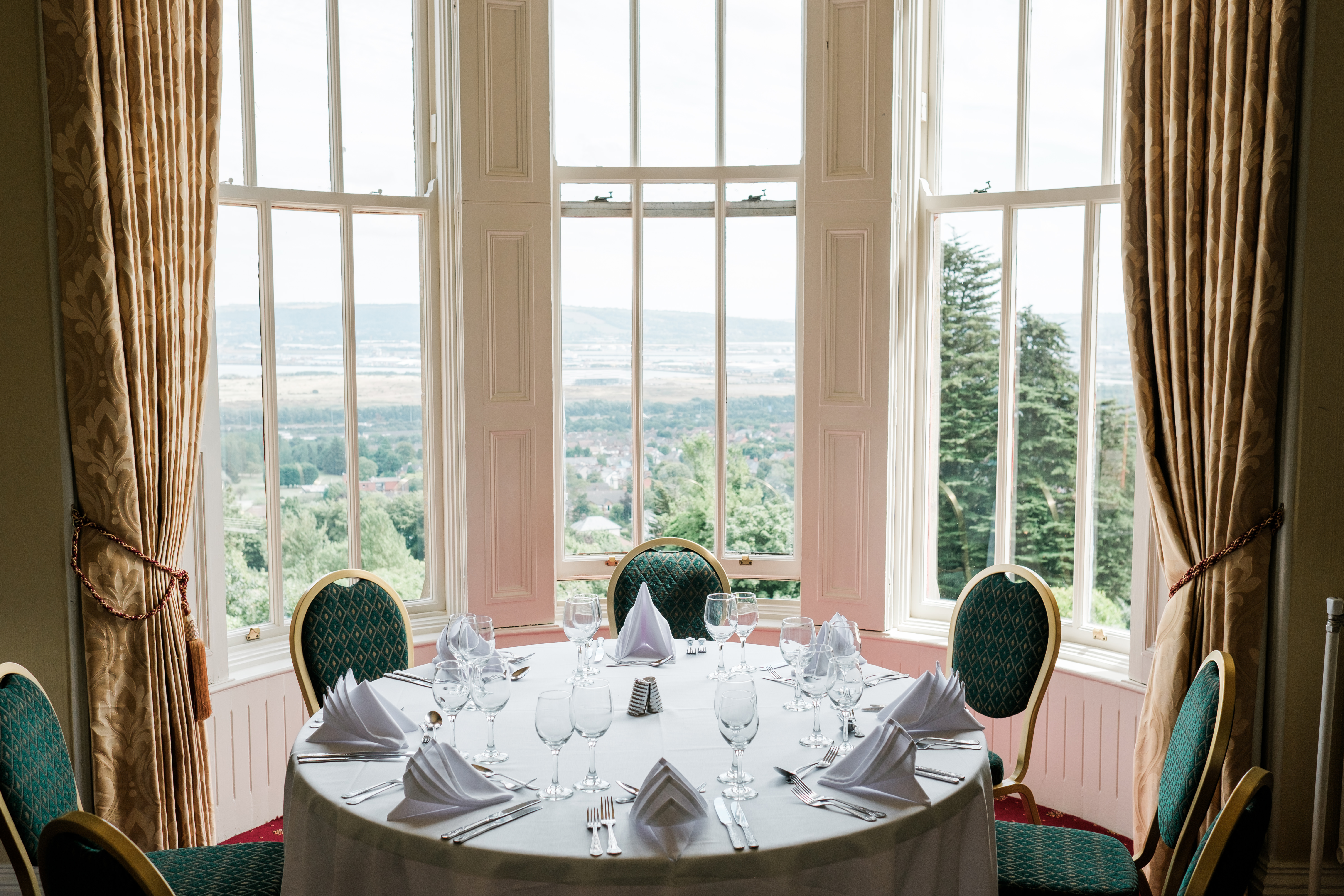 Ben Madigan Room set up with 10 chairs on either side of a long table for a wedding.