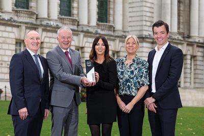 Pictured with the award is Gerry Lennon, chief executive of Visit Belfast, John Walsh, chief executive of Belfast City Council, Rachael McGuckin, director of business development, sustainability and t