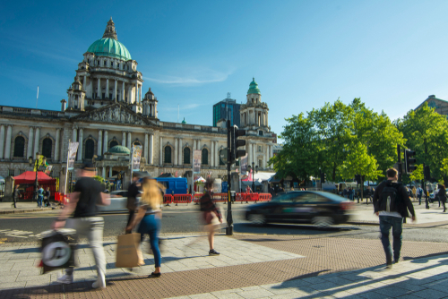 Shoppers, pedestrians and vehicles outside City Hall in Belfast city centre.