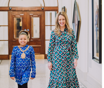 Lord Mayor of Belfast Councillor Kate Nicholl has handed over the chain of office to 9-year-old schoolgirl Ezinne Nwosu, as she becomes the city’s Lord Mayor for one day only.