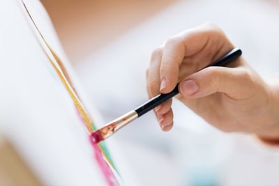 Artist holding paint brush