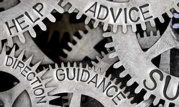 silver industrial cogs displaying the words help, advice and guidance