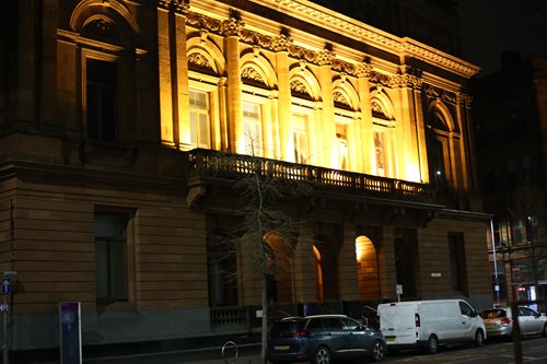 Belfast City Library illuminated at night.