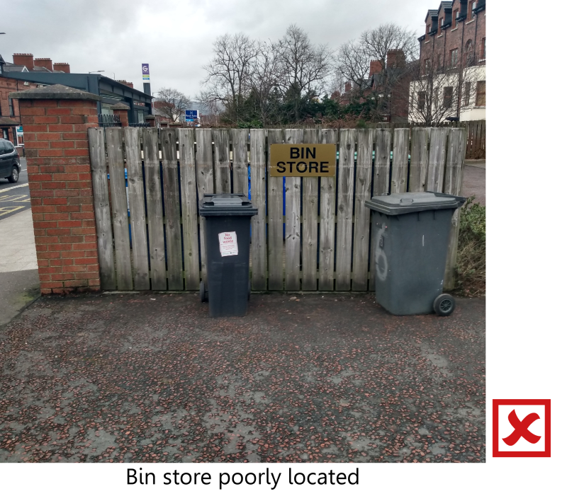 Poorly located bin store in visible communal area.