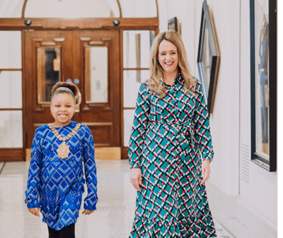 Lord Mayor of Belfast Councillor Kate Nicholl has handed over the chain of office to 9-year-old schoolgirl Ezinne Nwosu, as she becomes the city’s Lord Mayor for one day only.
