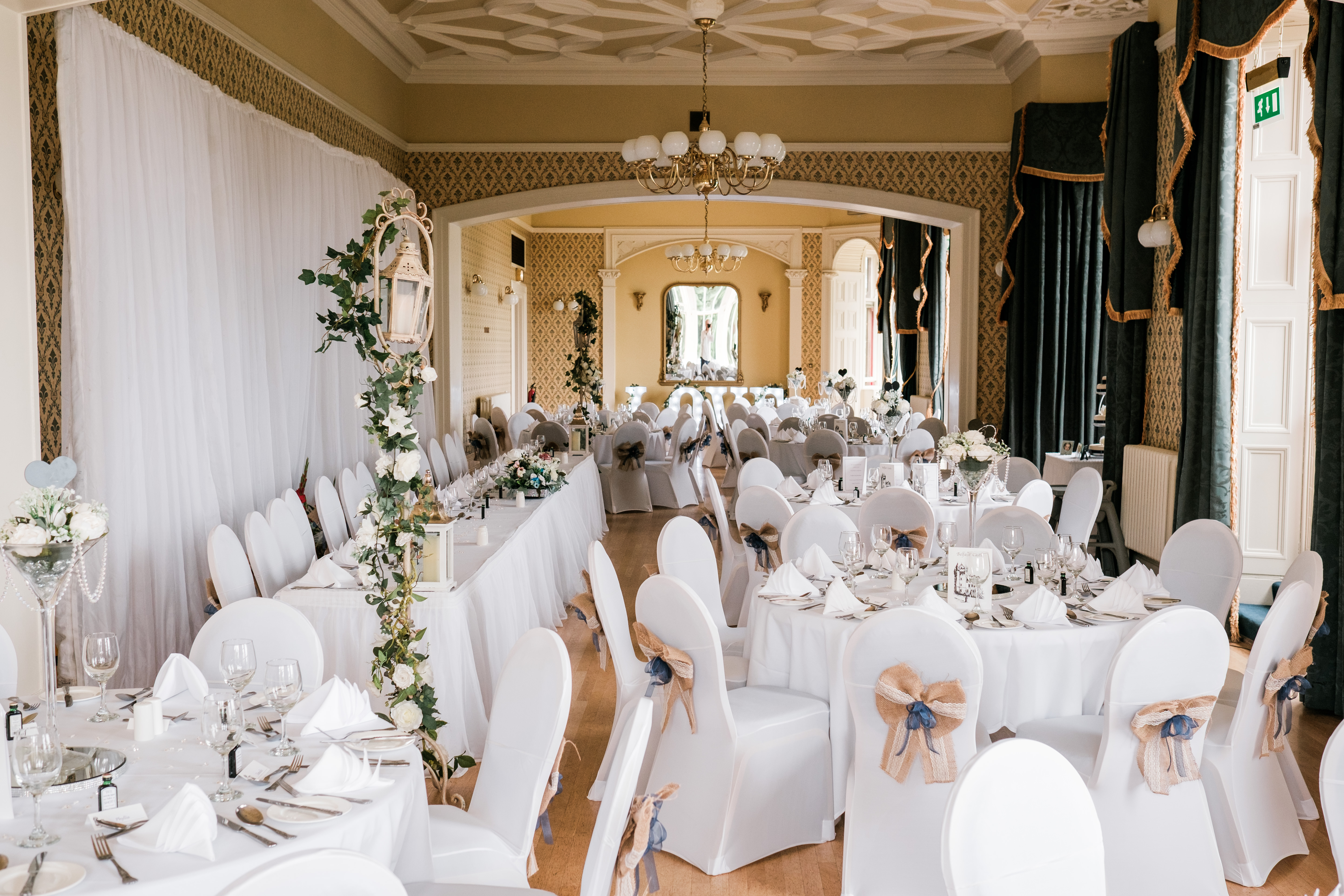 Chichester Room set up for a wedding banquet, showing three circular tables and the top rectangular table.