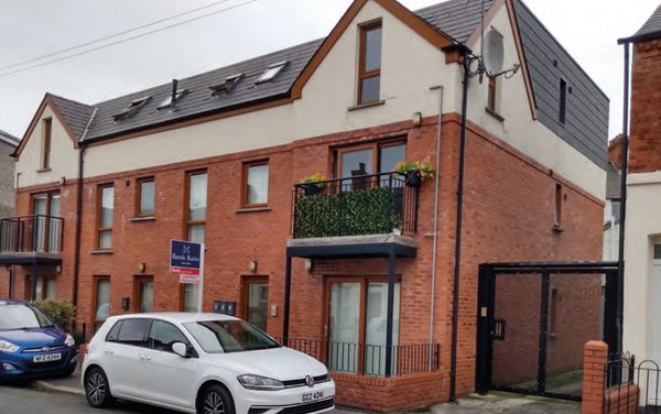 An infill apartment scheme in a traditional terraced street which employs materials similar to those of the neighbouring properties.